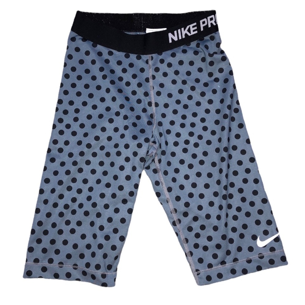 Grey and black polka dot Nikie Biker shorts.